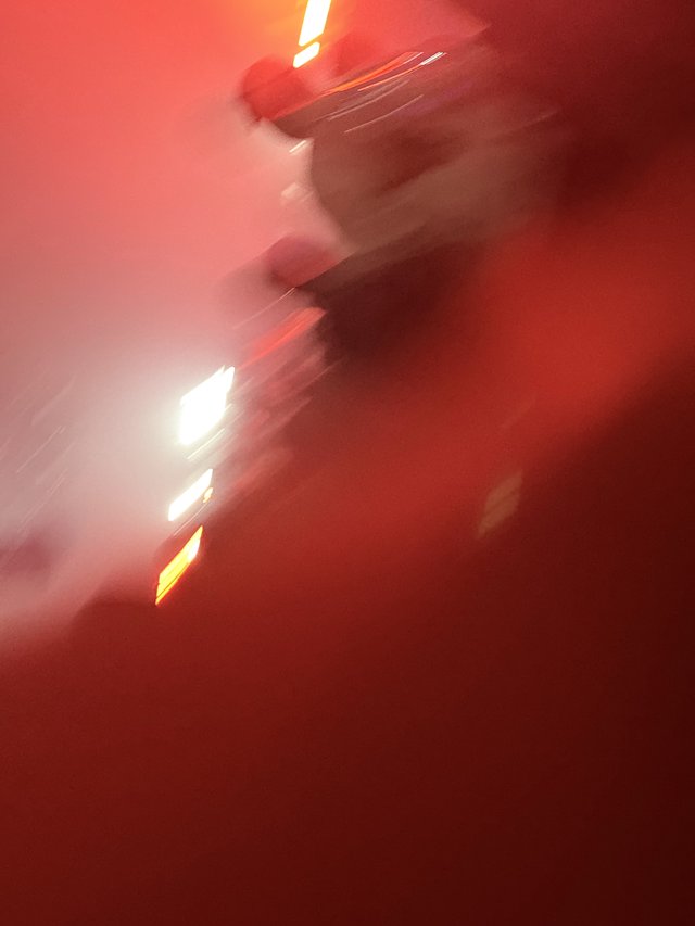 Motion Blur Silhouette in Red Concert Lighting