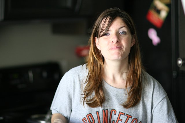 Candid Kitchen Portrait of a Thoughtful Woman