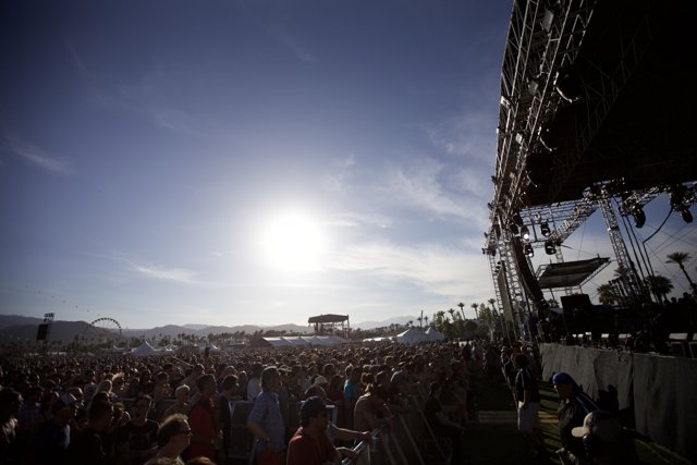 Coachella Crowd Cheers on Performer Under a Blue Sky