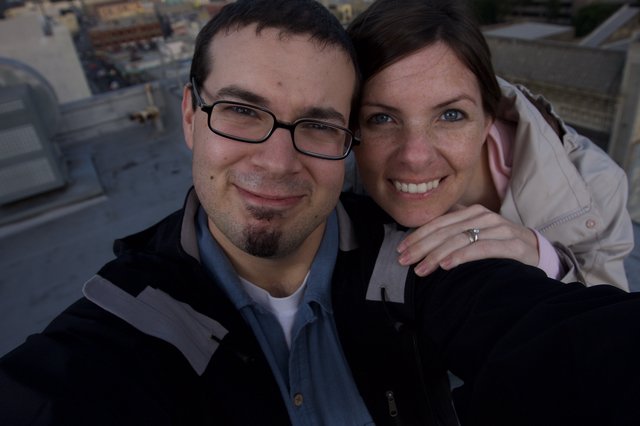 Rooftop Couple Selfie with City Views Below