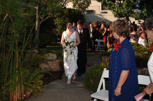 Bride Walks Down Outdoor Garden Wedding Aisle