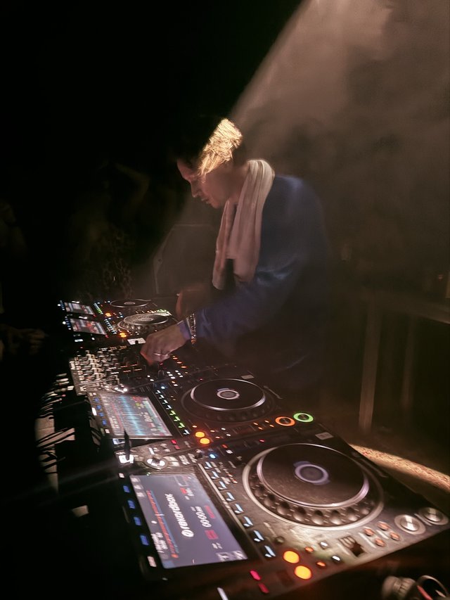 DJ Performance at London Nightclub with Professional Equipment