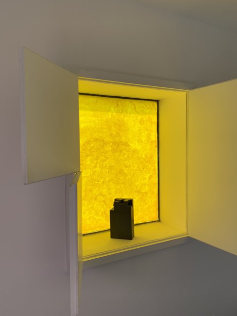 Yellow Window with a Mystery Object