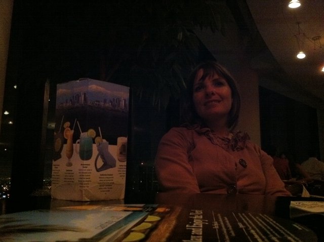 Evening Smile at a Dimly Lit Restaurant