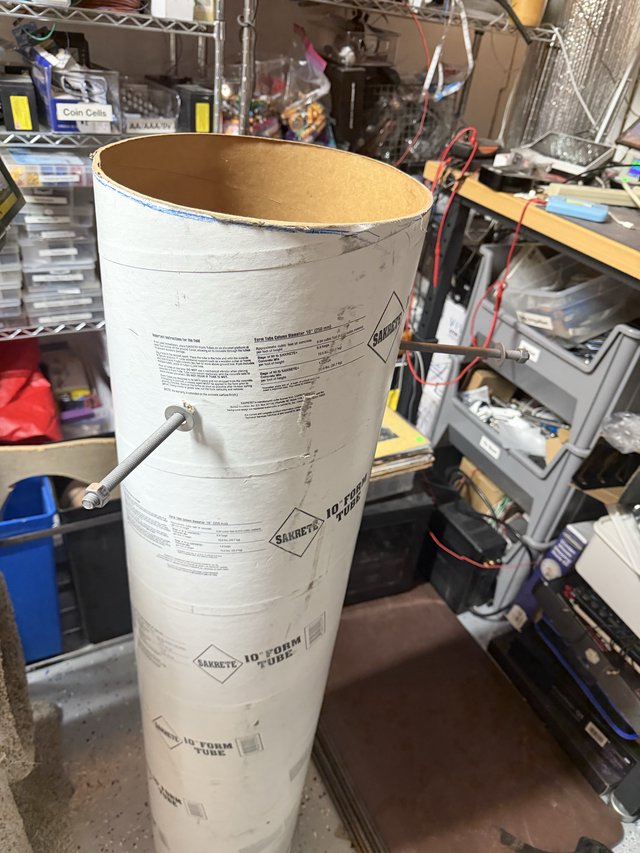 Industrial Cardboard Form Tube in Cluttered Workshop
