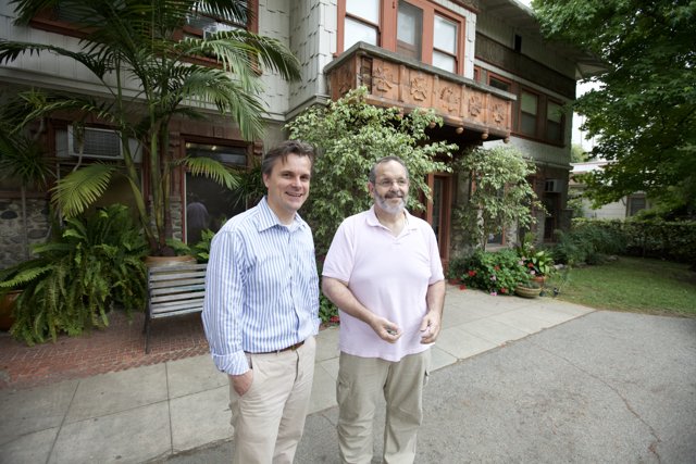 Two Men in Front of a Decorative House