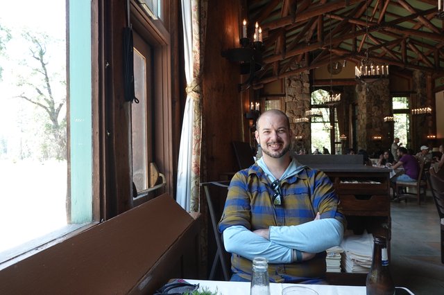 Man Relaxing in Rustic Restaurant Setting