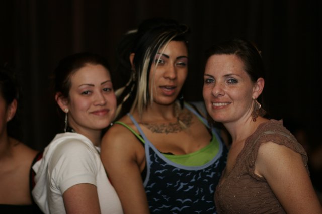 Three Friends Celebrate at Nightclub Anniversary Party