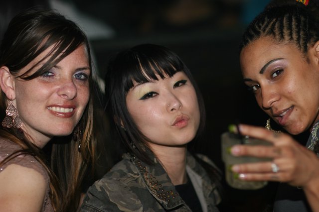Three Friends Posing at a Night Club Party