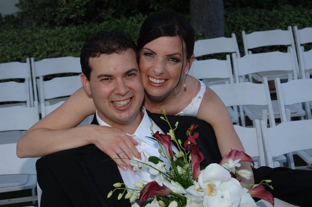 Joyful Newlyweds Embrace at Outdoor Wedding Ceremony