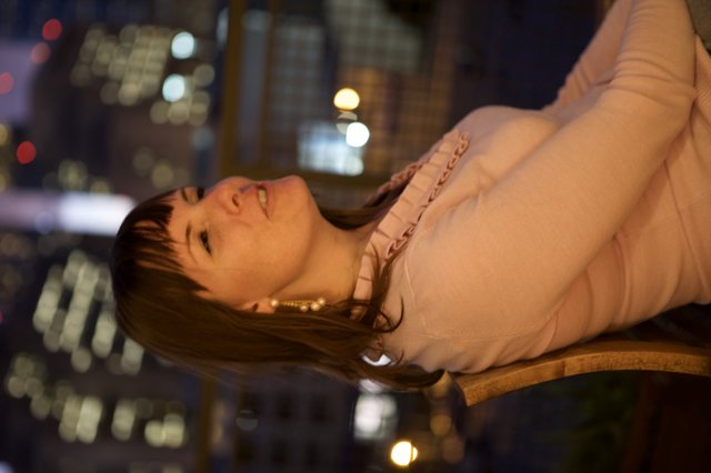 Penelope Gazing Upward Against City Night Lights