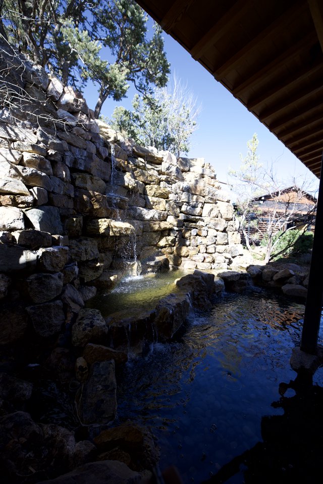 Natural Stone Waterfall and Pool in Tranquil Garden Setting