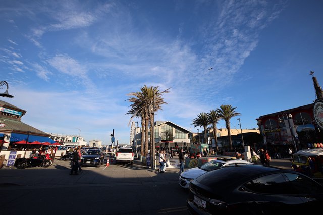 Bustling Coastal Shopping District at Golden Hour