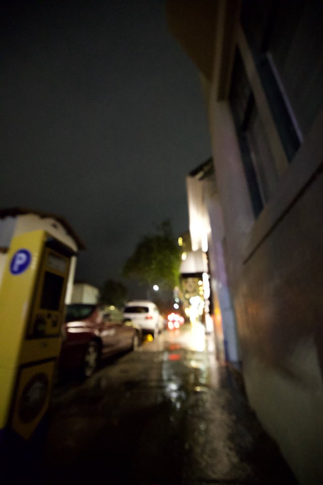 Rainy Night Street Scene in Urban Downtown