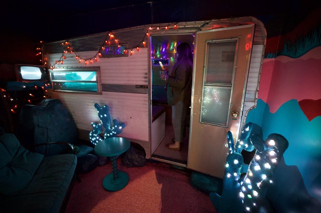 Whimsical Desert Trailer Art Installation at Night