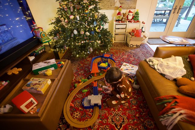 Child Playing with Train Set on Christmas Morning