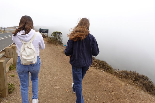 Two Women Walking in Coastal Fog