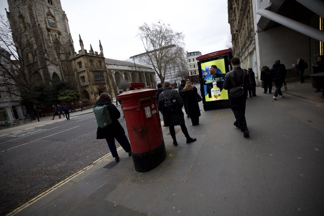 Urban Street Scene with Historic Church and Red Postbox