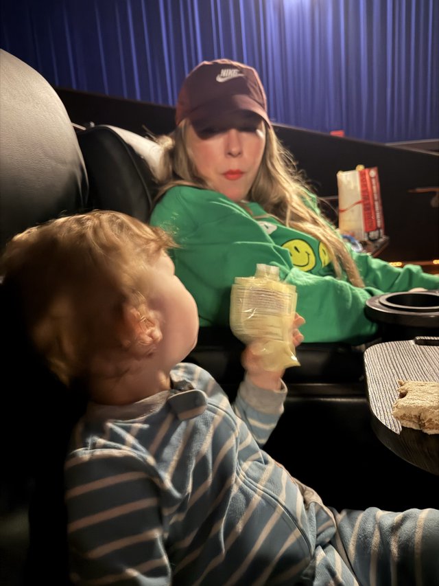 Cozy Movie Night: Mother and Child Relaxing Together