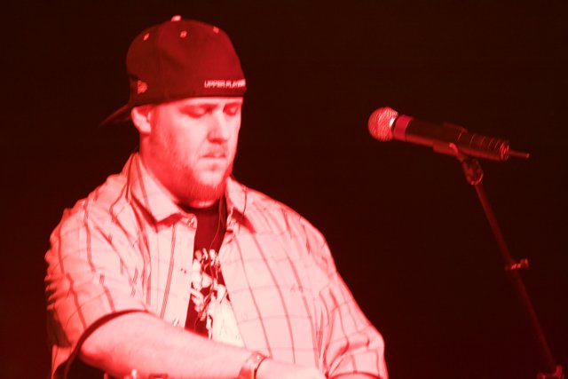 Baseball Cap-wearing Singer Performs at 2008 Coachella Music Festival