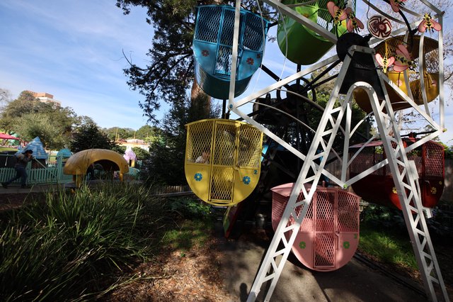 Colorful Ferris Wheel Gondolas at Fantasyland Amusement Park