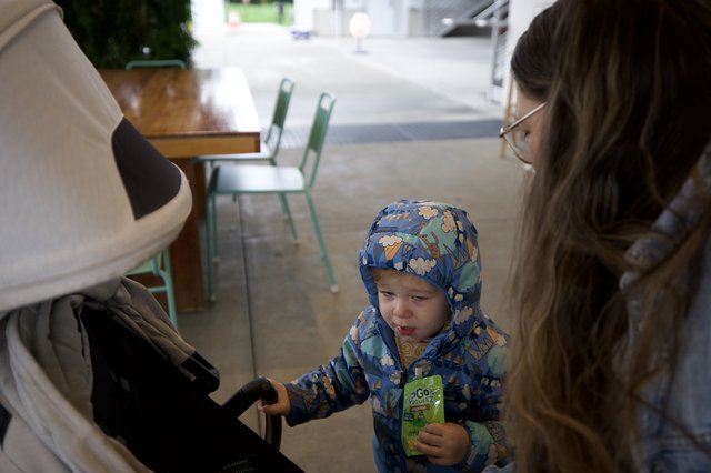 Young Child's First Restaurant Experience in Winter Coat