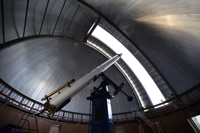 Historic Telescope Under Observatory Dome Architecture