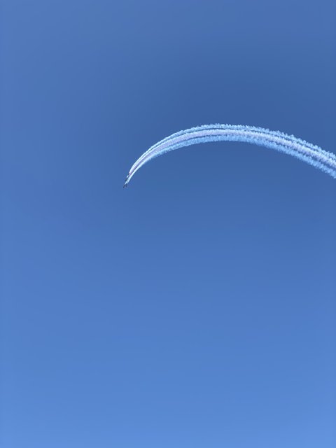 Jet soaring through the Azure Sky
