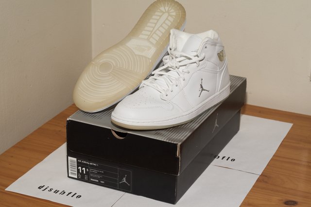 Classic White Sneakers on Top of a Box