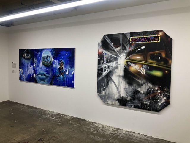 A Display of Contemporary Paintings in a Modern Art Gallery