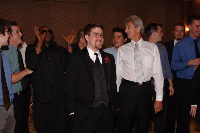 Groom and Groomsmen Celebrate at Wedding Reception