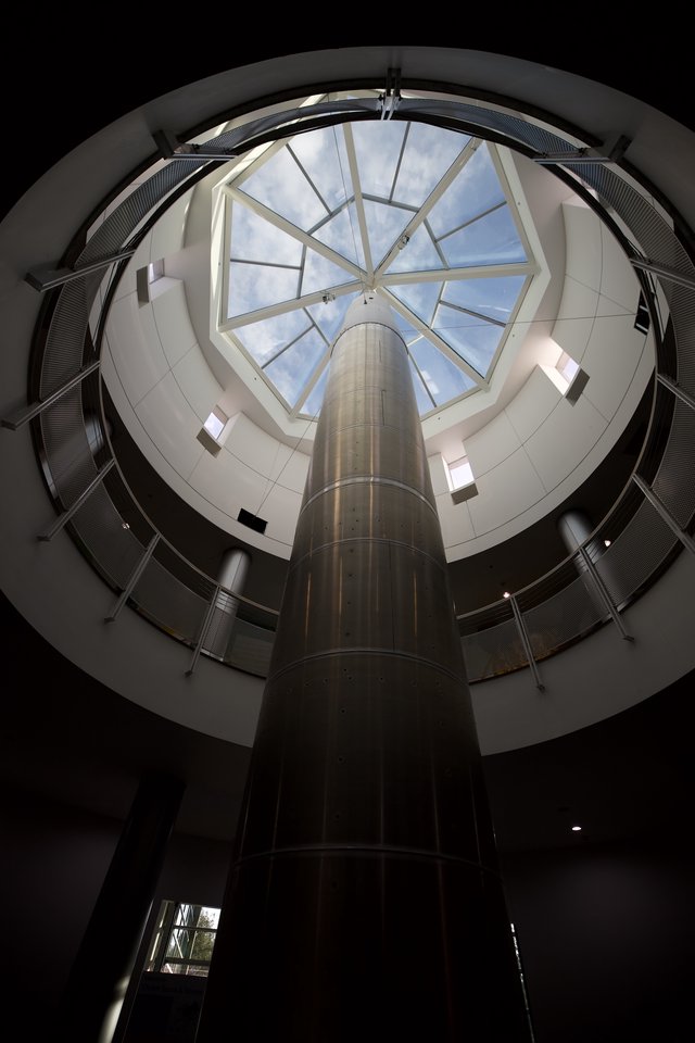 Skyward View Through Modern Cylindrical Glass Atrium