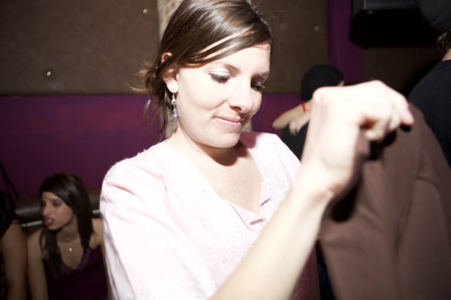 Woman Dancing at Dimly Lit Nightclub Event