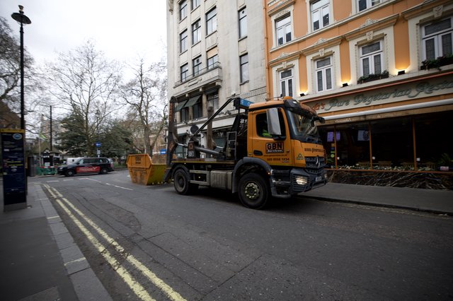 Skip Lorry Making Collection on London Street