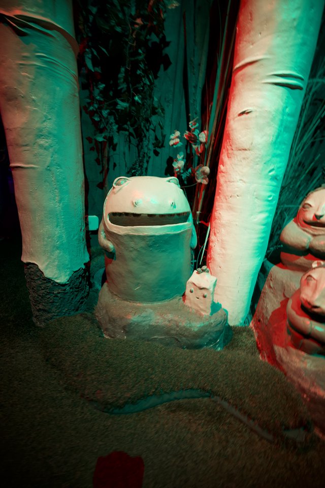 Whimsical Frog Trash Can in Turquoise Alleyway