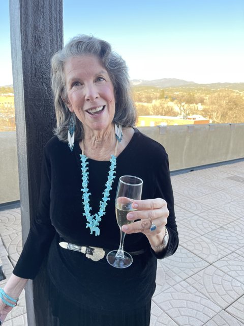 Rhoda B enjoying a glass of wine with a view