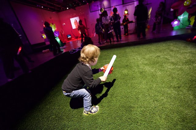 Child with Light Stick at Baby Rave Event