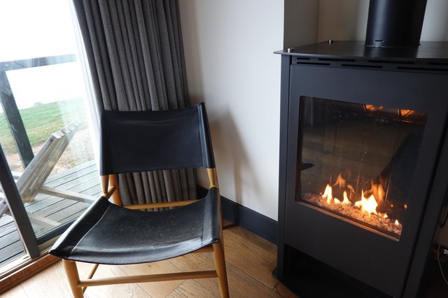 Cozy Fireside Reading Nook with Modern Stove