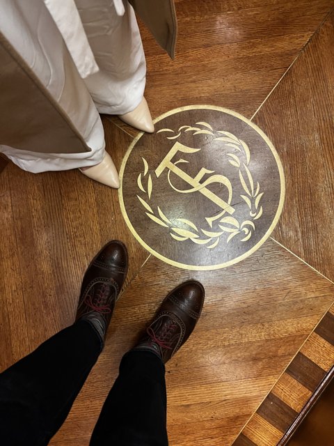 Standing on a Stained Wood Logo Floor