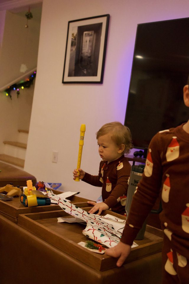 Toddler Playing Yellow Recorder at Christmas