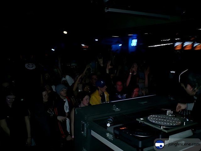 Nightclub DJ Setting the Night on Fire