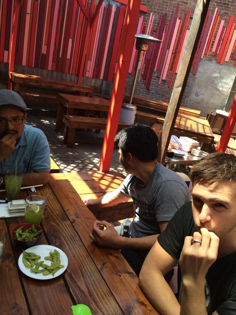 Three Men Lunching at a Cafe