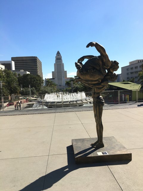 Skater Statue Doing a Backflip in the City