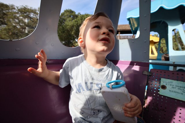 Joyful Toddler Playing at Colorful Playground