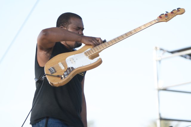Musician Strums Electric Guitar at Coachella Festival