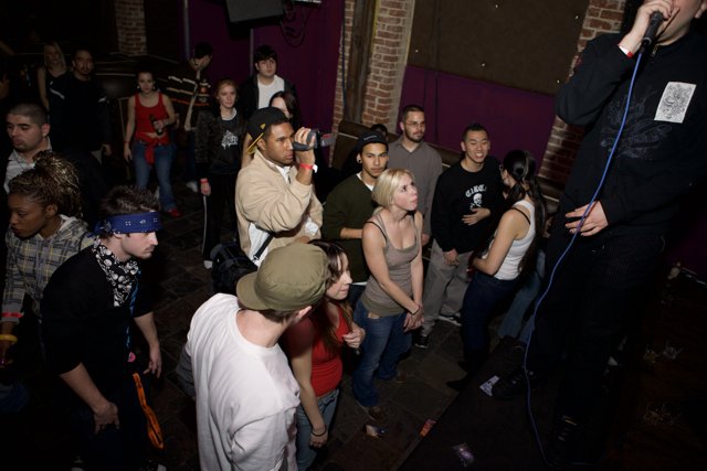Urban Music Performer Captivates Crowd at Night Club