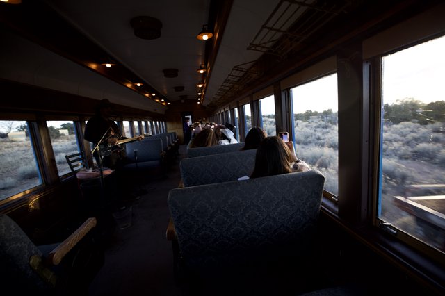 Scenic Train Journey Through Desert Landscape at Dusk