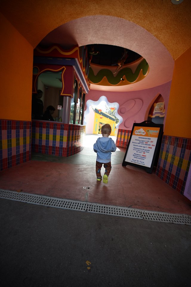 Toddler Exploring Whimsical Children's Play Area Entrance