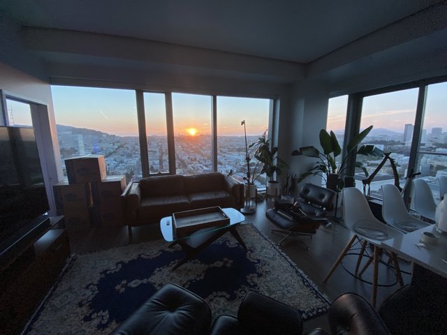 Sunset View from a Chic Penthouse Living Room