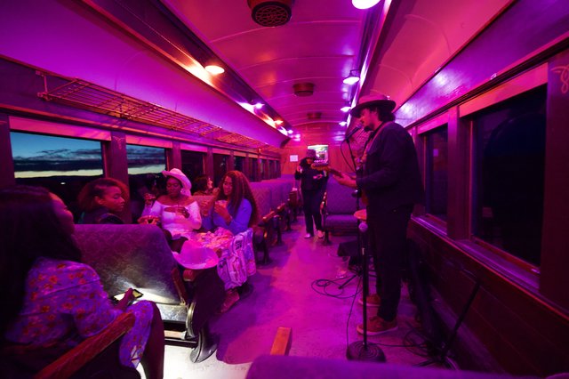 Live Music Performance Inside Illuminated Train Car